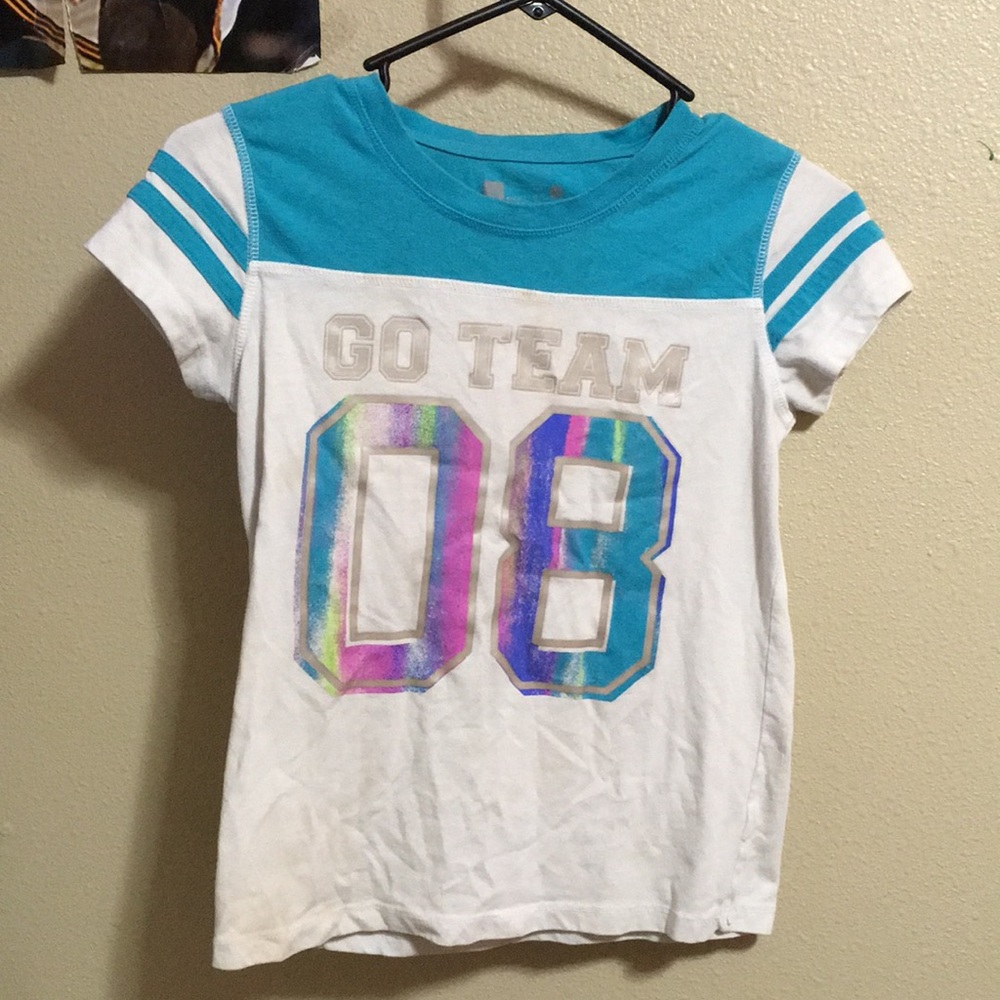 Team shirt; number 08 and says “Go Team!”